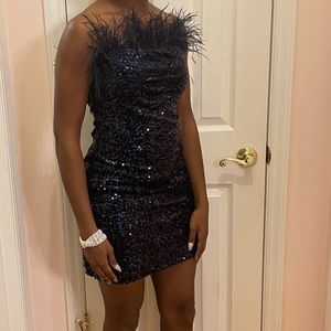 Navy blue sequin strapless dress made by B.Darlin with feathers.